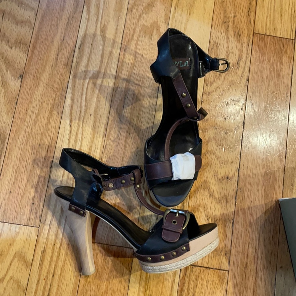 High heeled black and brown sandals